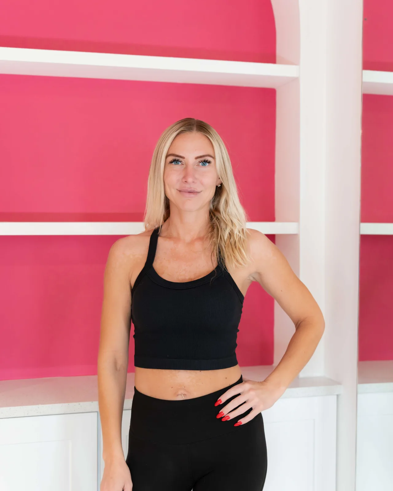 Bicep curls in front of the pink arches