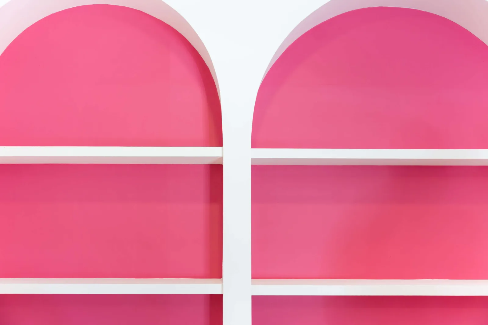The pink shelving wall at Sana Sculpt Studios